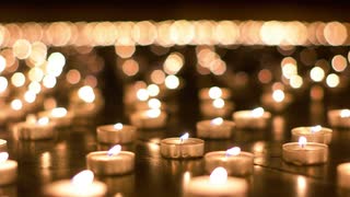detailed-shot-of-burning-candles-in-the-church_bgqbhc24__S0000